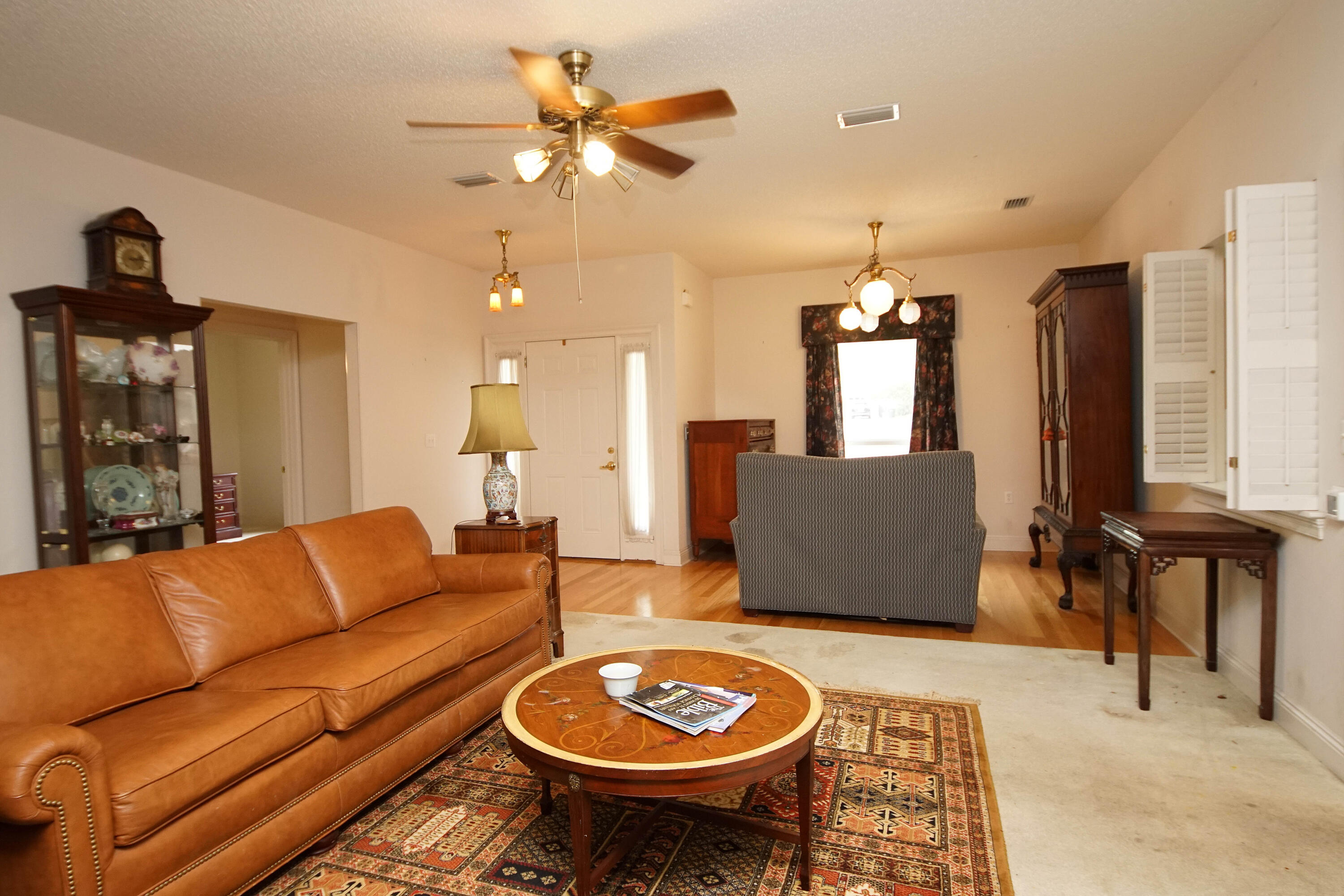 600 Northwest Mooney Road Fort Walton Beach, FL 32547 - Photo 10 of 35 a living room with furniture and a dining table