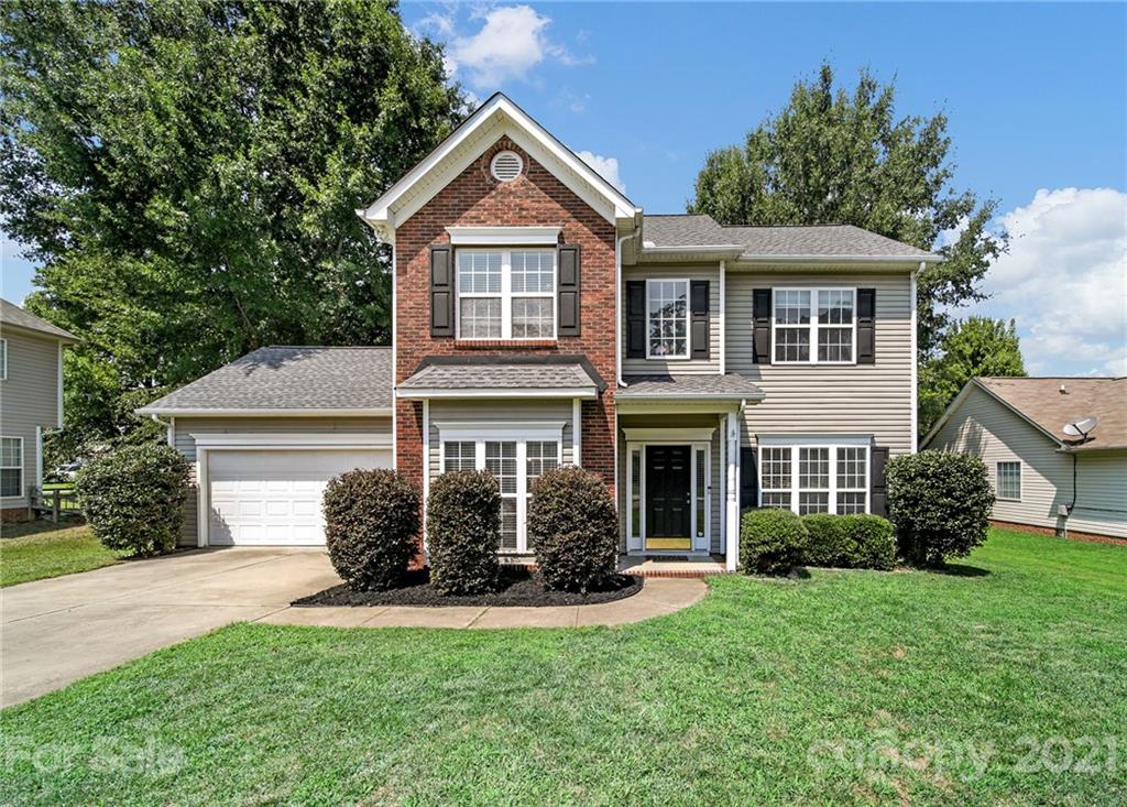 3307 Creek Trail Road Indian Trail, NC 28079 - Photo 1 of 43 a front view of a house with a yard and garage