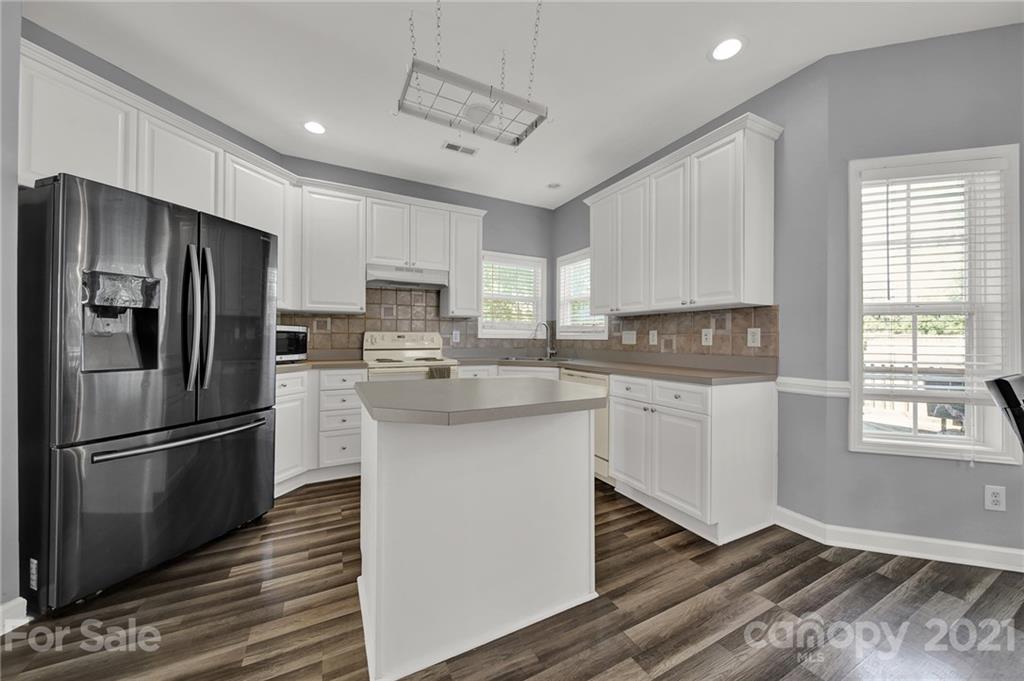 3307 Creek Trail Road Indian Trail, NC 28079 - Photo 12 of 43 a kitchen with stainless steel appliances a refrigerator sink and microwave