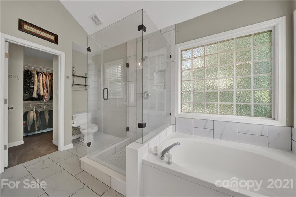 3307 Creek Trail Road Indian Trail, NC 28079 - Photo 24 of 43 a bathroom with a bathtub and a shower