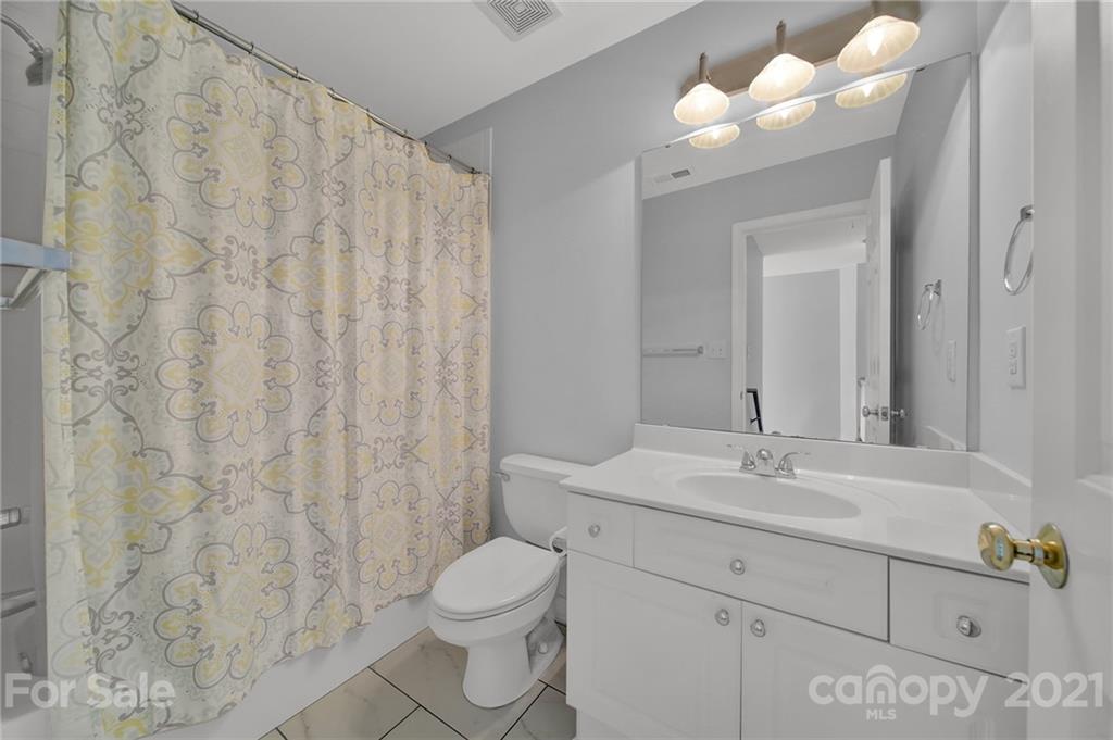 3307 Creek Trail Road Indian Trail, NC 28079 - Photo 28 of 43 a bathroom with a sink a toilet and a mirror