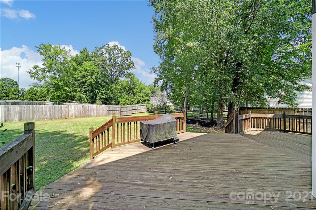 3307 Creek Trail Road Indian Trail, NC 28079 - Photo 32 of 43 a view of a roof deck with couches and wooden fence