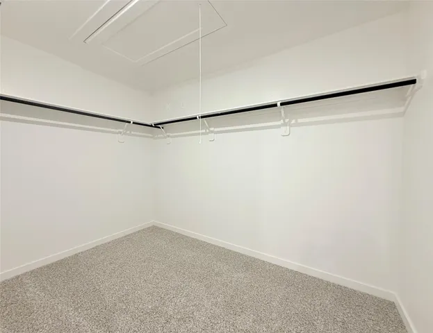 a view of a room with empty racks on the wall