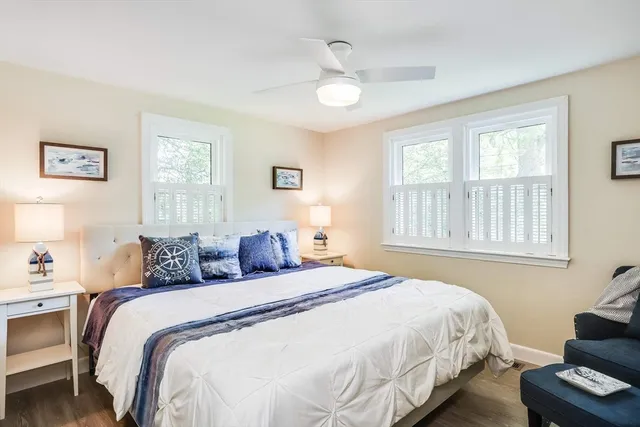 a bedroom with bed and a window