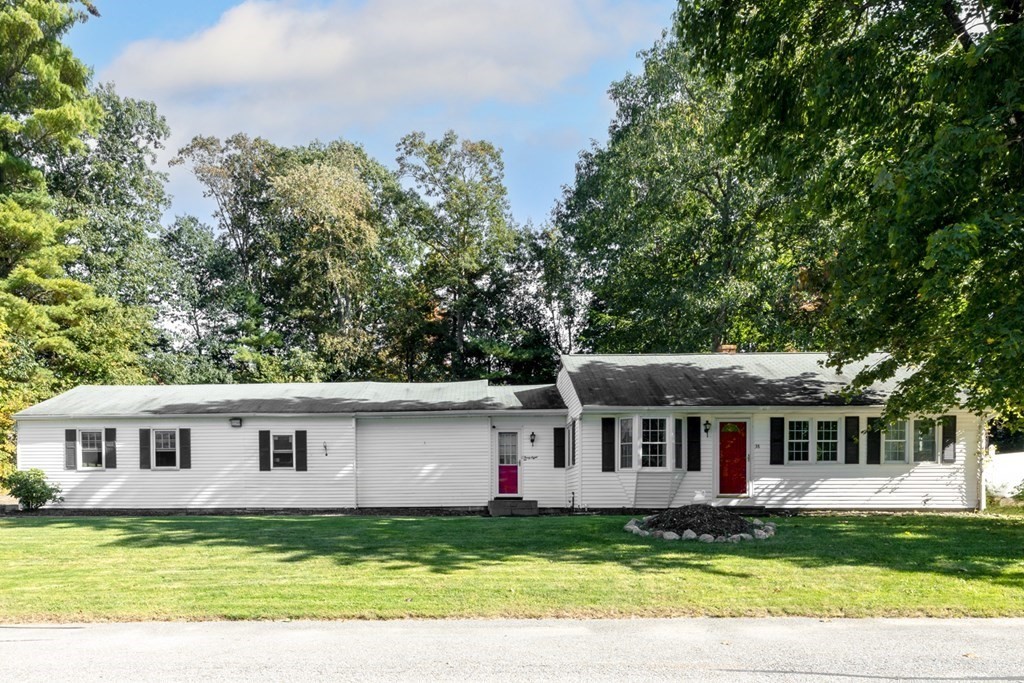 38 Ridge Street Westminster, MA 01473 - Photo 17 of 27 a front view of a house with a garden and trees