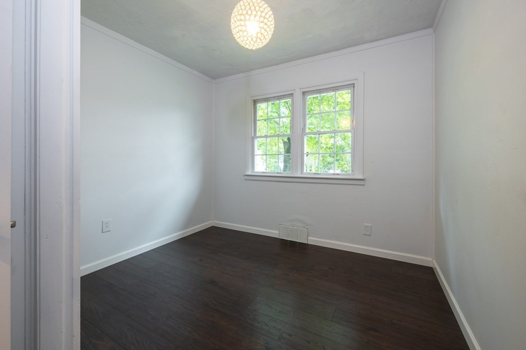 38 Ridge Street Westminster, MA 01473 - Photo 20 of 27 an empty room with wooden floor and windows