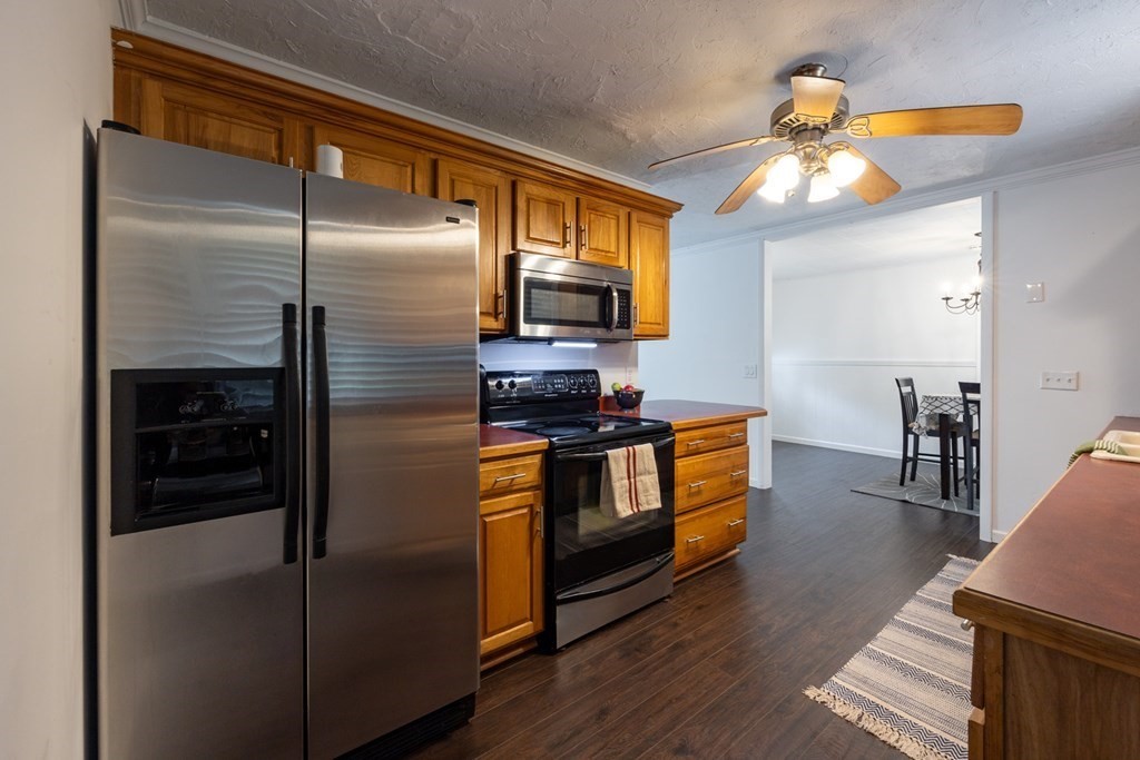 38 Ridge Street Westminster, MA 01473 - Photo 23 of 27 a kitchen with stainless steel appliances granite countertop a refrigerator a stove and a sink
