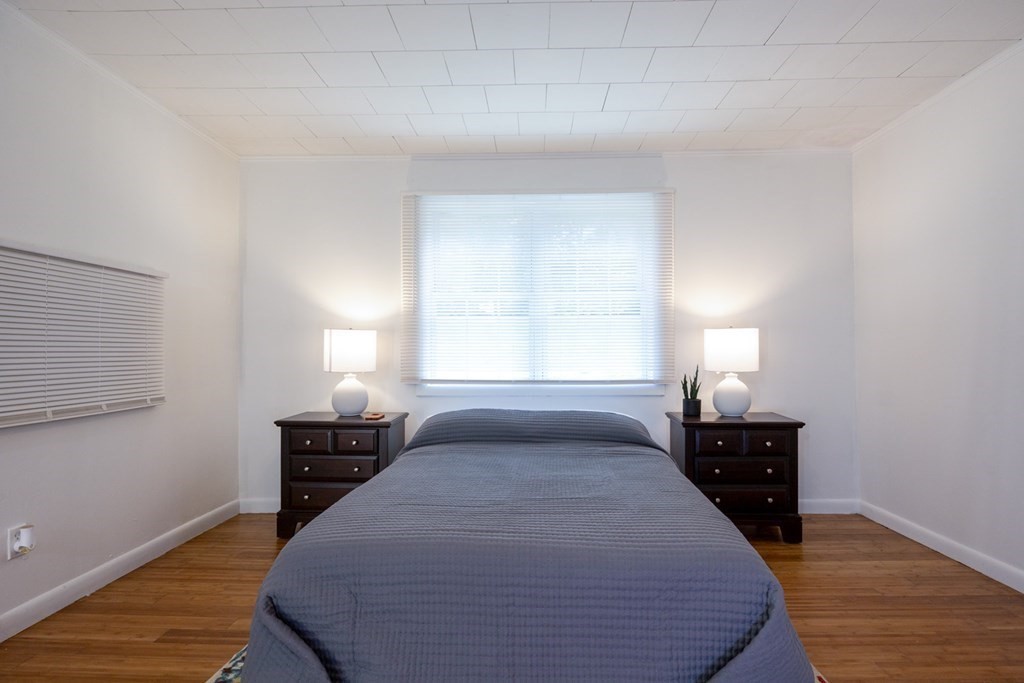 38 Ridge Street Westminster, MA 01473 - Photo 26 of 27 a bedroom with a bed and wooden floor
