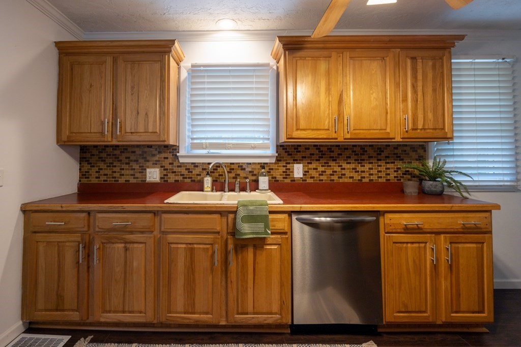 38 Ridge Street Westminster, MA 01473 - Photo 5 of 27 a kitchen with granite countertop a sink and cabinets