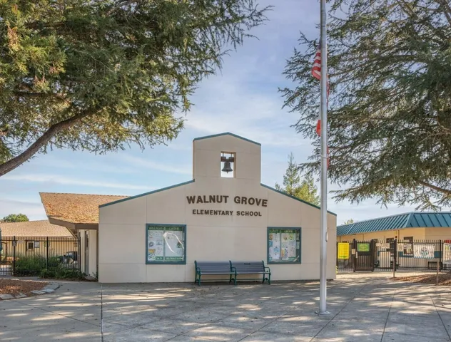 a front view of a house with garage