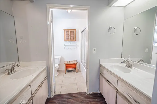 a bathroom with a sink double vanity and a vanity