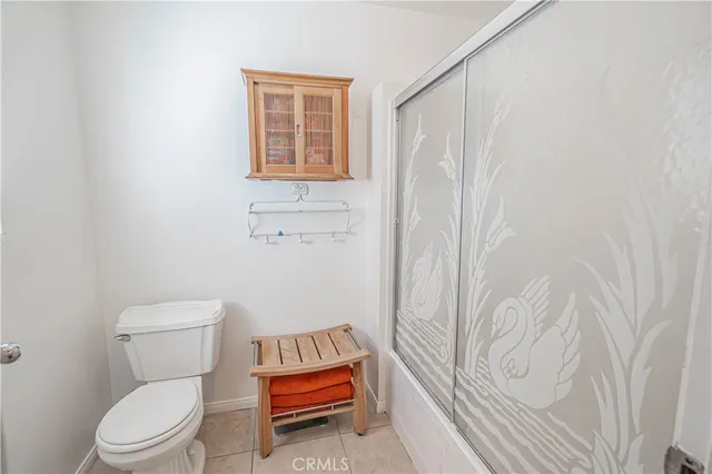 a white toilet sitting next to a bathroom sink