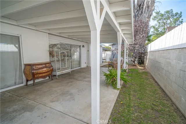 a view of a porch with seating space