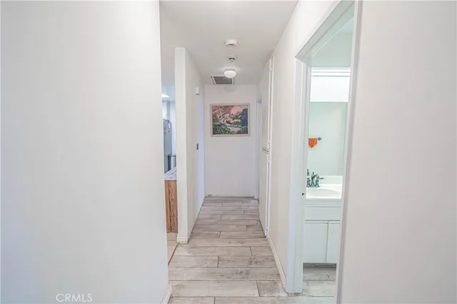 a view of a hallway with closet