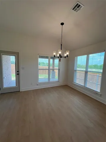 a view of empty room with windows