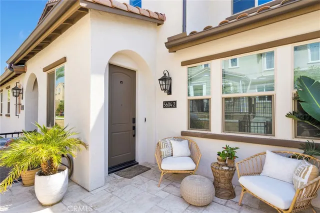 a view of a two chairs in the patio