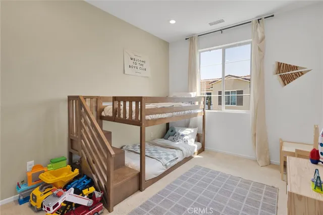 a bedroom with furniture and a window