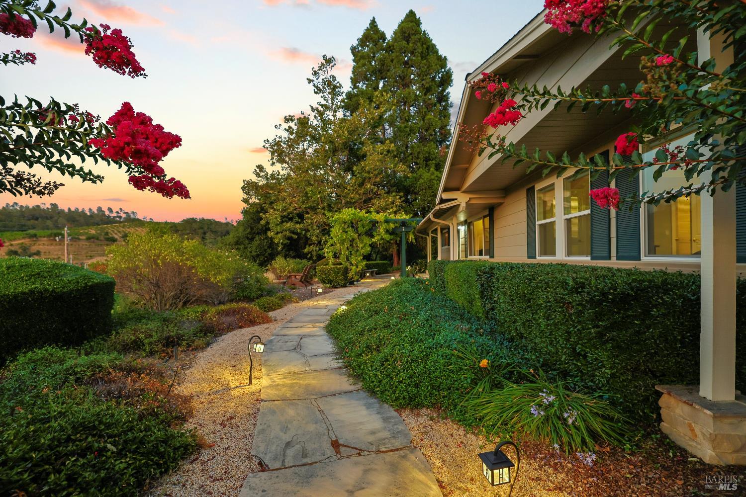 1389 Canyon Road Geyserville, CA 95441 - Photo 7 of 59 a front view of a house with a yard and potted plants
