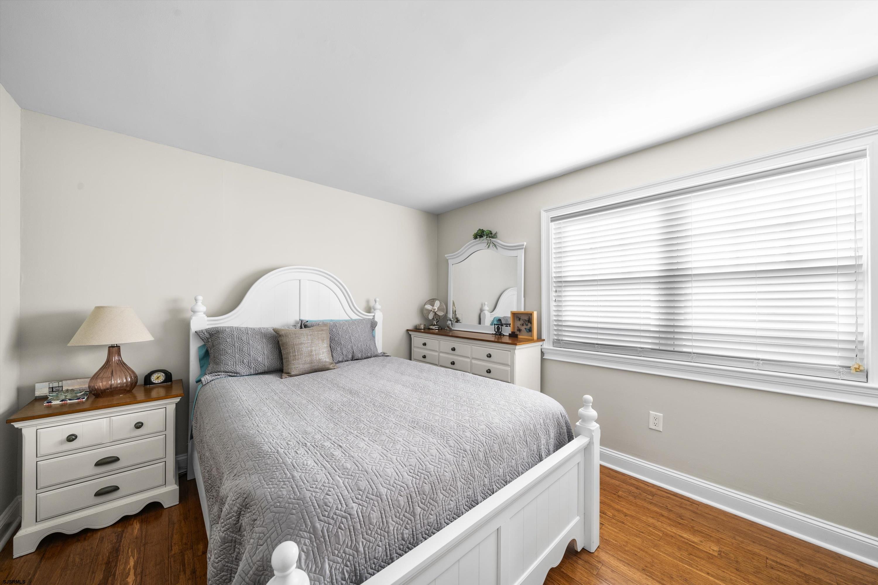 51 Simpson Road, Unit 2 Ocean City, NJ 08226 - Photo 32 of 43 a bedroom with a bed and a window