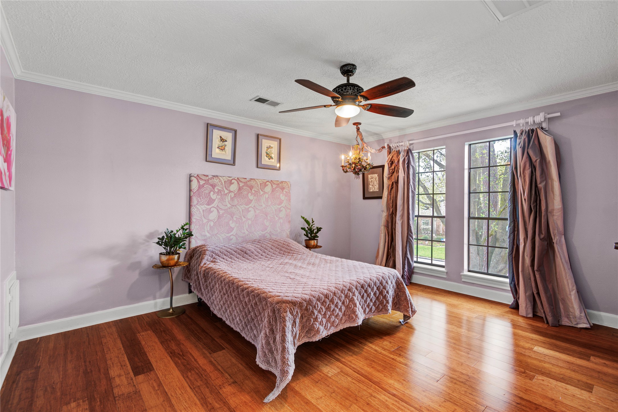 8412 Hidden Trail Lane Spring, TX 77379 - Photo 22 of 43 This spacious upstairs secondary bedroom offers bamboo wood flooring, generous natural light, and a peaceful retreat for family or guests.