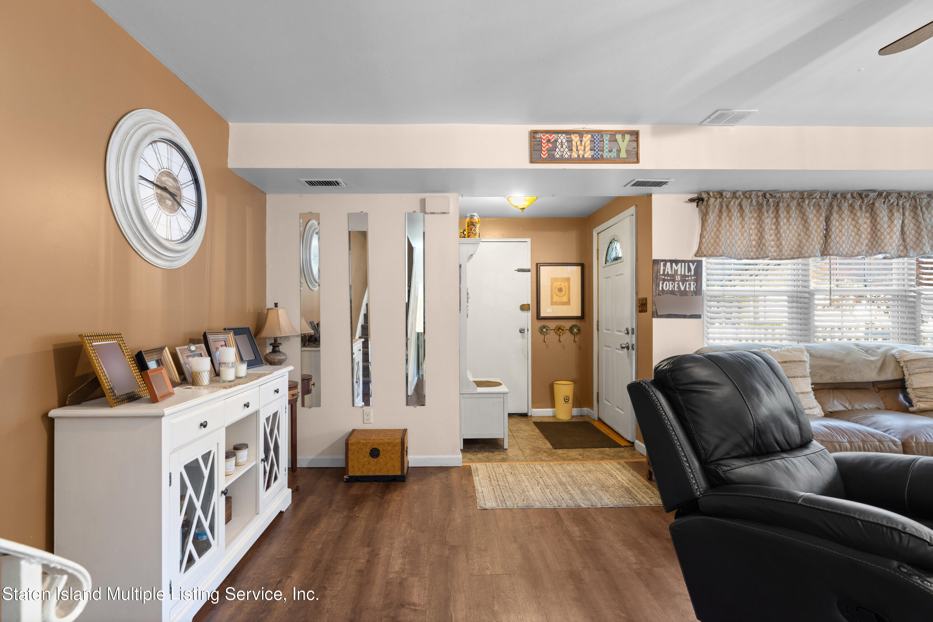 47 Hampton Green Staten Island, NY 10312 - Photo 3 of 38 a living room with furniture and a table