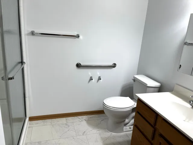 a bathroom with a toilet and a sink