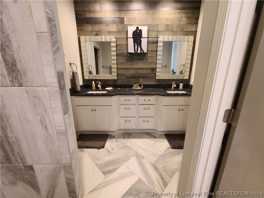 215 Devon Circle Aberdeen, NC 28315 - Photo 17 of 35 a bathroom with a sink and a mirror