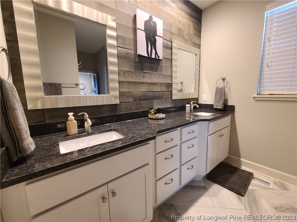 215 Devon Circle Aberdeen, NC 28315 - Photo 20 of 35 a close view of sink and mirror