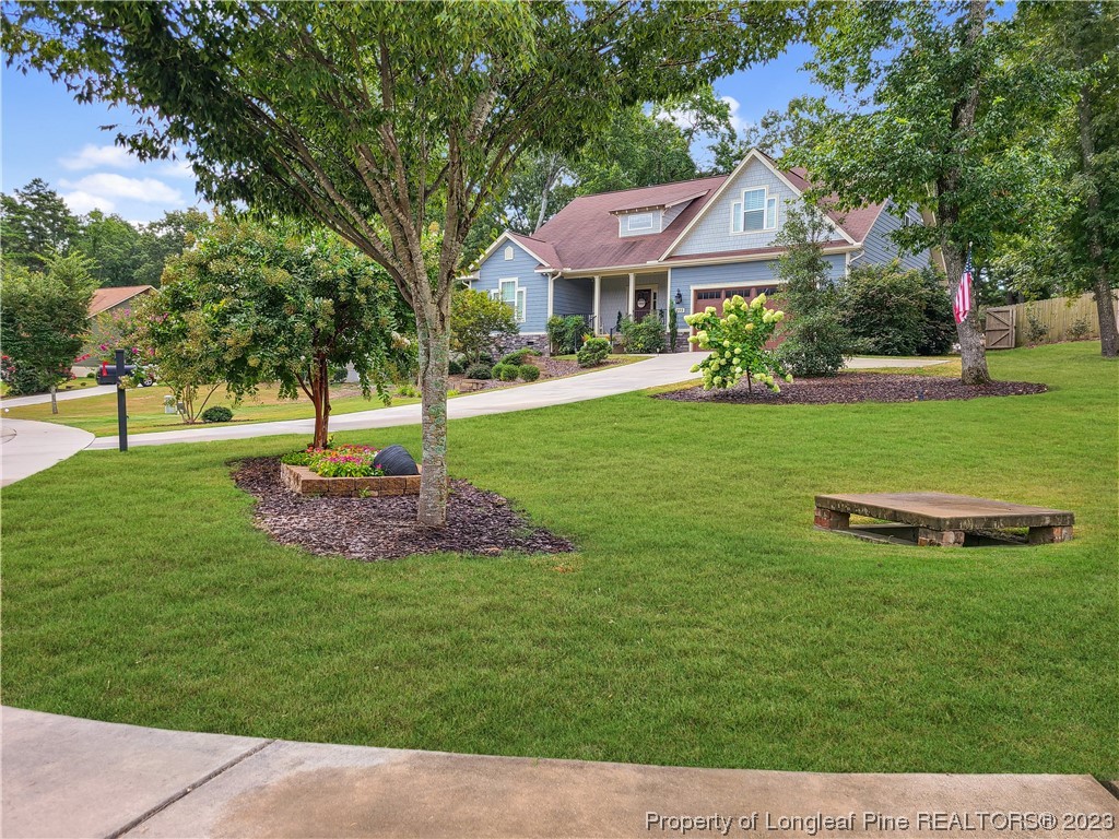 215 Devon Circle Aberdeen, NC 28315 - Photo 2 of 35 a front view of a house with a yard