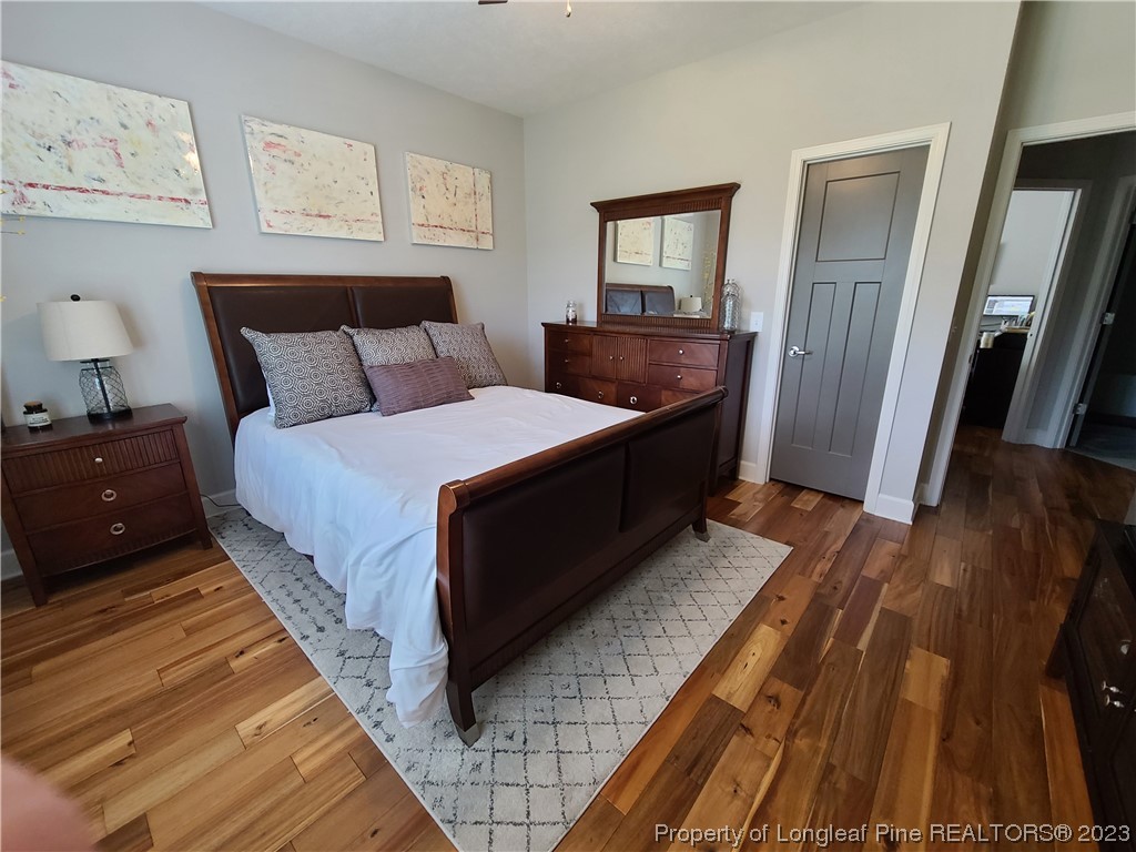 215 Devon Circle Aberdeen, NC 28315 - Photo 22 of 35 a spacious bedroom with a bed and a mirror