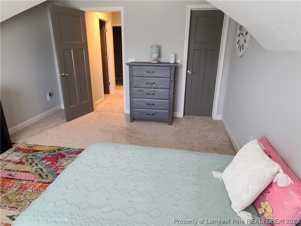 215 Devon Circle Aberdeen, NC 28315 - Photo 27 of 35 a bedroom with a bed and a cabinets