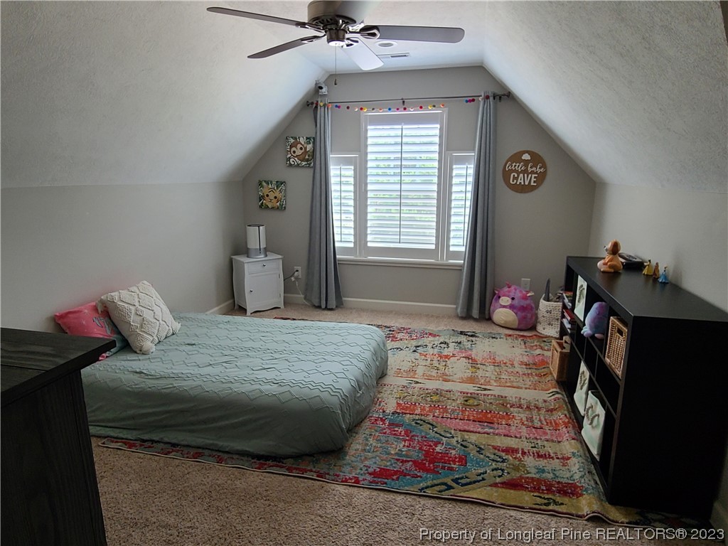 215 Devon Circle Aberdeen, NC 28315 - Photo 28 of 35 a bedroom with a bed and wooden floor