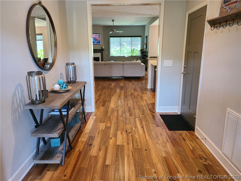 215 Devon Circle Aberdeen, NC 28315 - Photo 3 of 35 a view of a living room and dining room