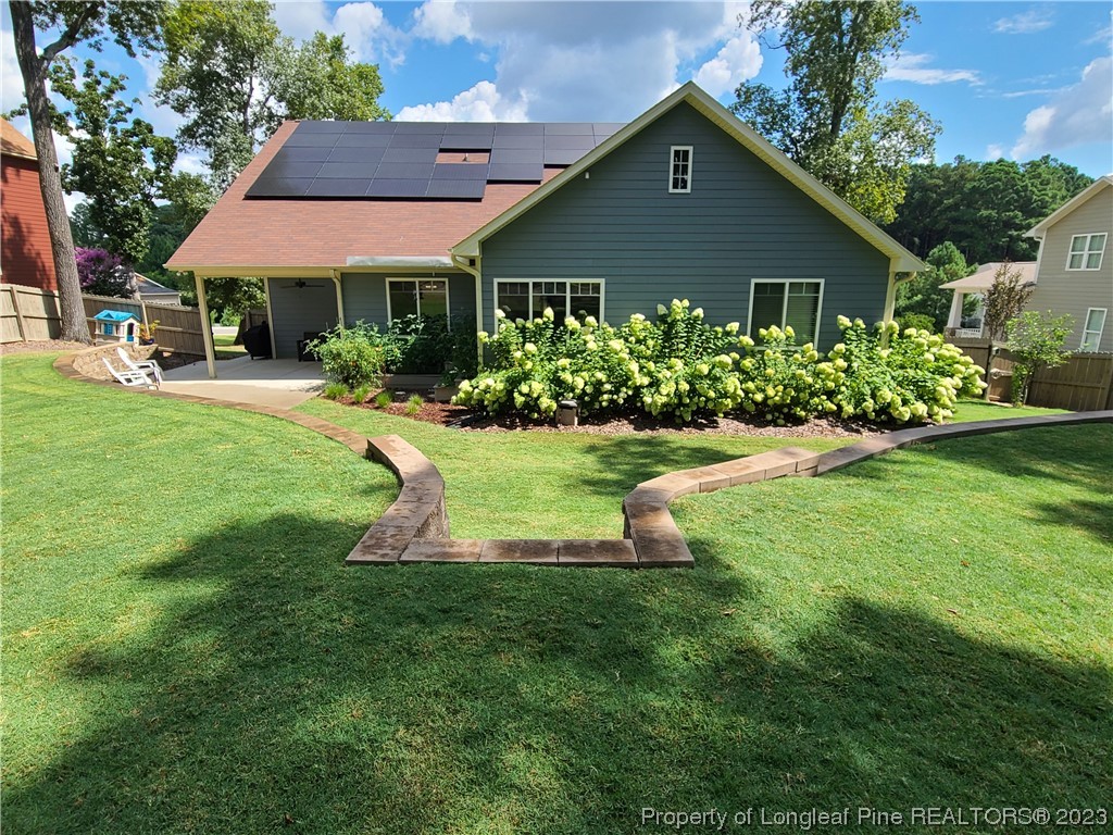 215 Devon Circle Aberdeen, NC 28315 - Photo 33 of 35 a front view of a house with a yard