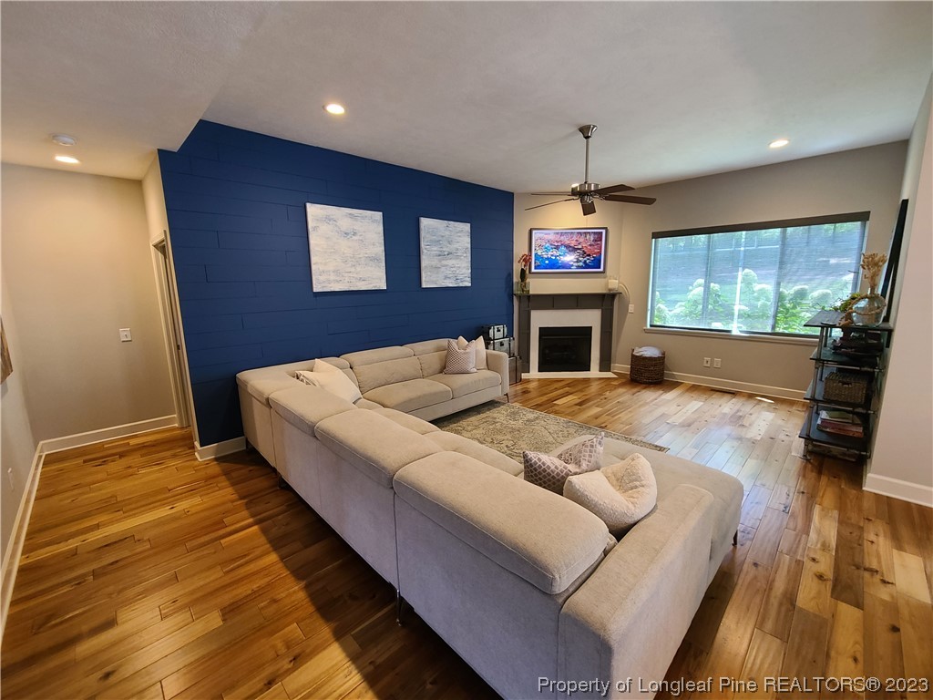 215 Devon Circle Aberdeen, NC 28315 - Photo 4 of 35 a living room with fireplace furniture and a flat screen tv