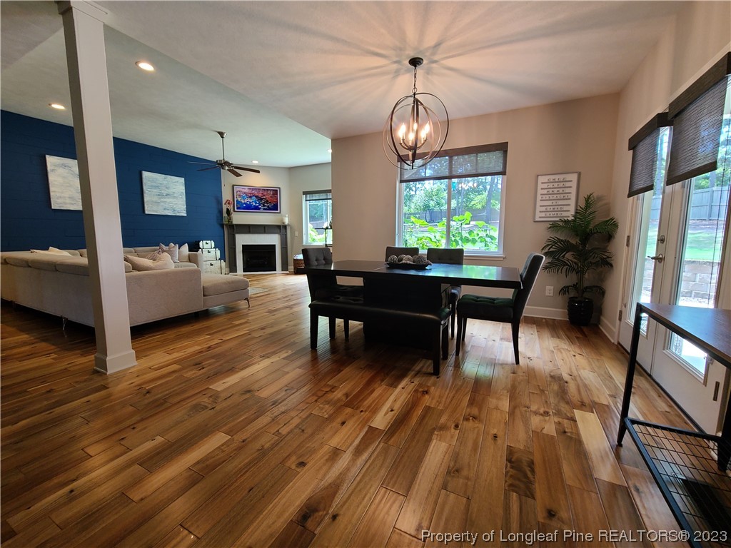 215 Devon Circle Aberdeen, NC 28315 - Photo 6 of 35 a living room with furniture dining table and a large window