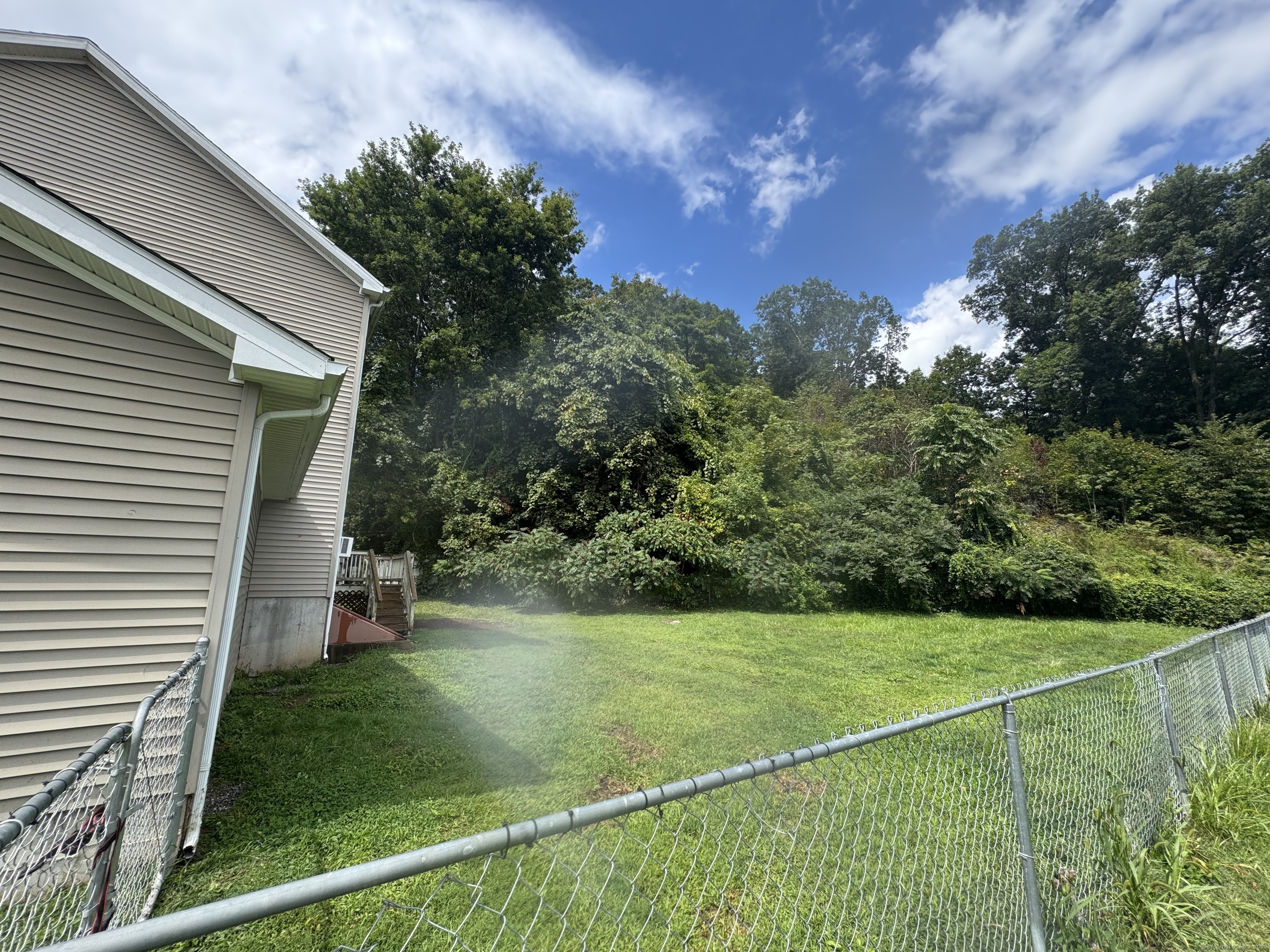 11 Carpenter Street Norwich, CT 06360 - Photo 12 of 12 a view of a house with a backyard