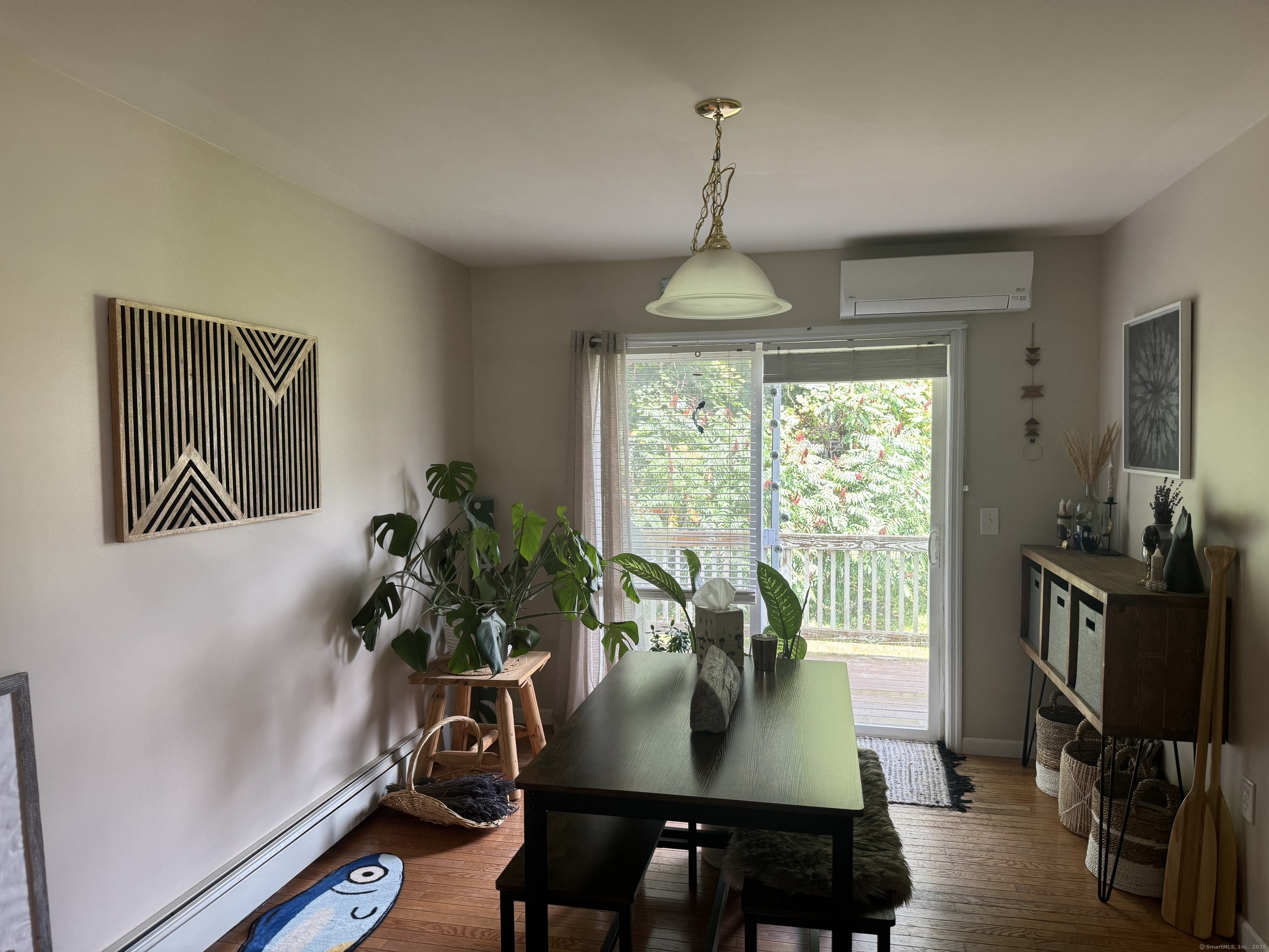 11 Carpenter Street Norwich, CT 06360 - Photo 3 of 12 a view of a dining room with furniture window and wooden floor