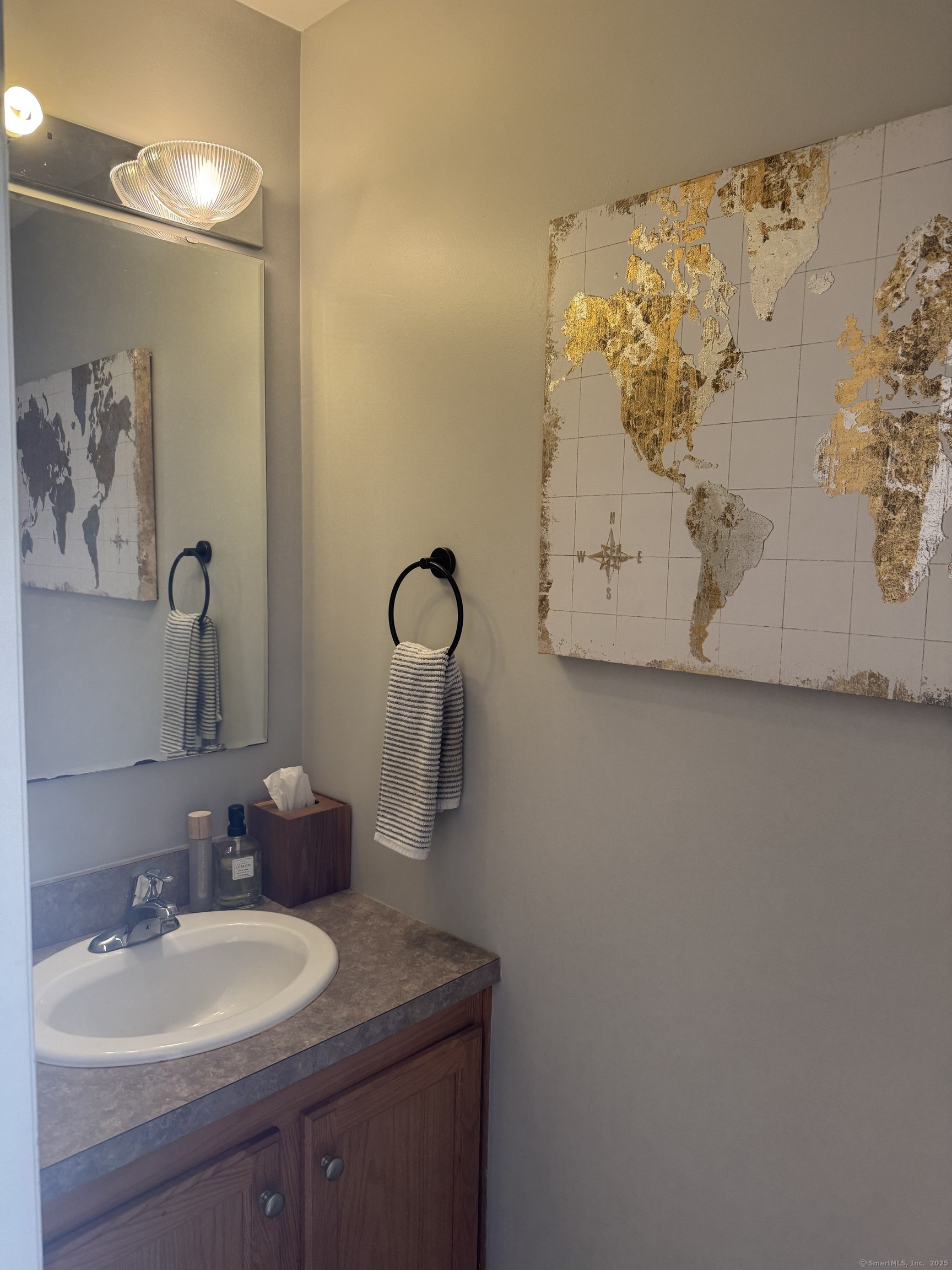 11 Carpenter Street Norwich, CT 06360 - Photo 6 of 12 a bathroom with a sink and mirror