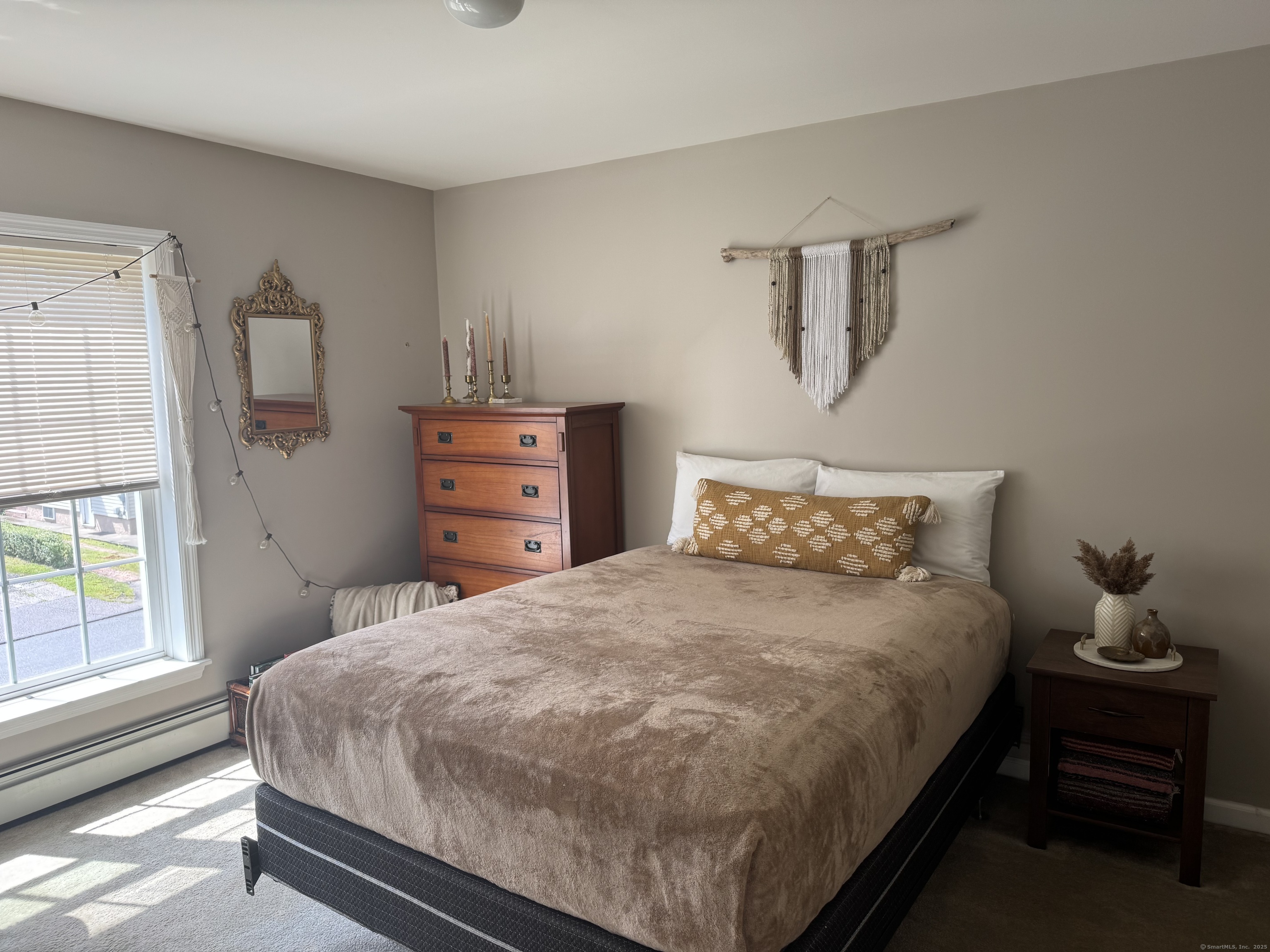 11 Carpenter Street Norwich, CT 06360 - Photo 7 of 12 a bedroom with a bed and window