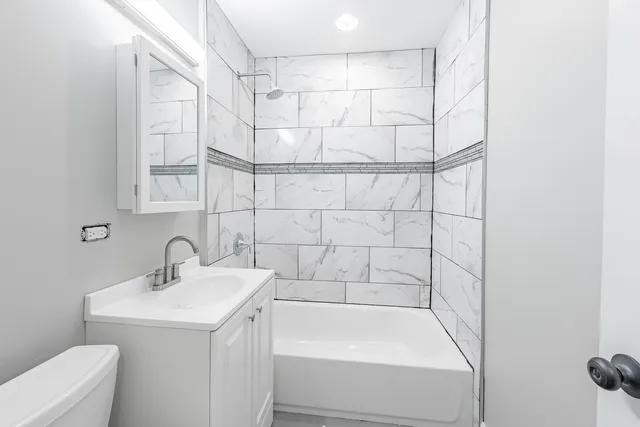 a bathroom with a sink and a bathtub