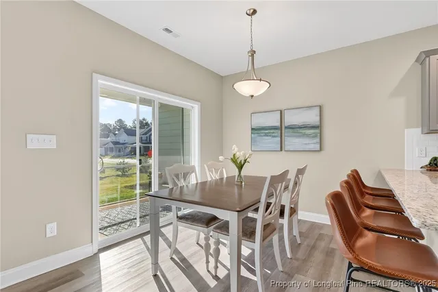 a room with a window and a ceiling fan