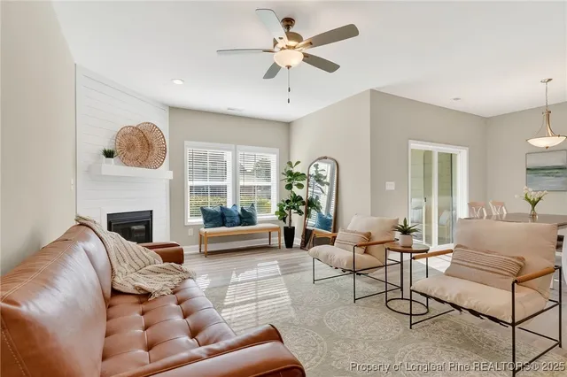a bathroom with a granite countertop toilet sink and mirror