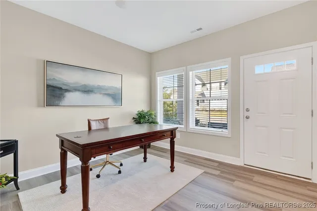 a kitchen with granite countertop cabinets stainless steel appliances and a sink