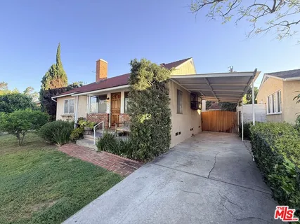 a house view with a garden space