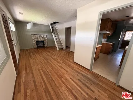 a view of livingroom with furniture and wooden floor