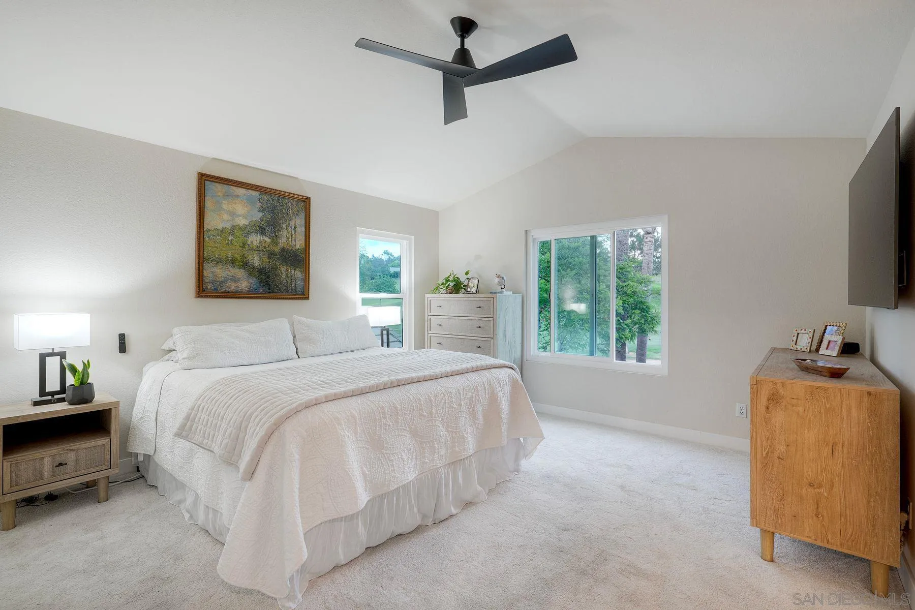 529 Peach Tree Way San Marcos, CA 92069 - Photo 15 of 30 a bedroom with a bed a window and couch