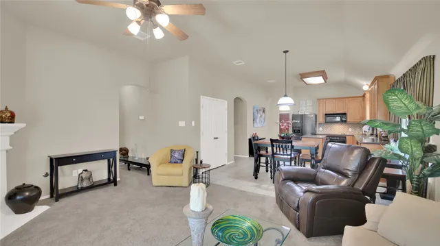 a dining room with furniture and window
