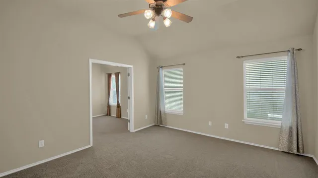 a room with furniture and a book shelf