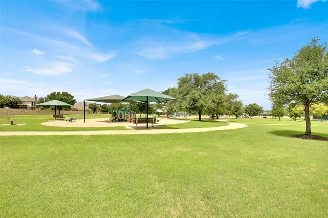 a view of a swimming pool with an outdoor space and seating area